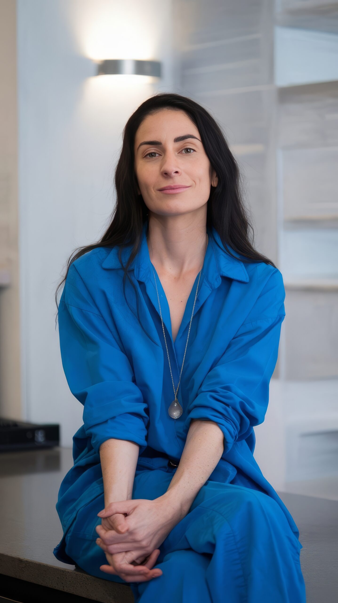 medium shot woman sitting countertop
